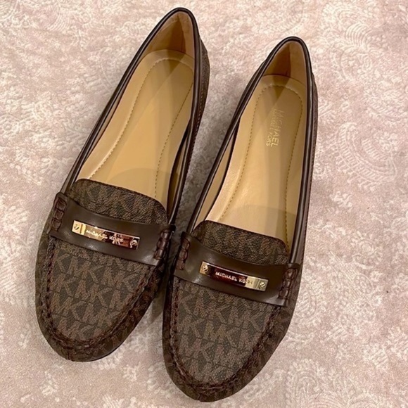 Brand New Michael Kors Brown Loafers Slip On Flats w/ Gold Tone Metal Logo Bar - Picture 2 of 16